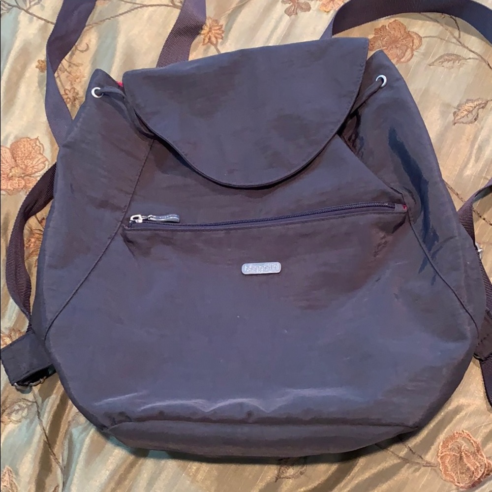 Baggallini backpack grey with pink interior.